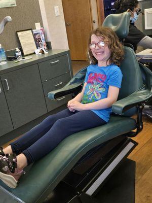 My granddaughter in the dentist chair.