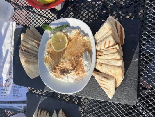 Whipped goat cheese dip with honey and cinnamon, and pita.