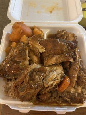 Large brown stew chicken, rice and peas, and sweet yams.