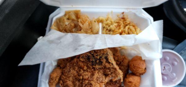 Pork chops, spicy cabbage, macaroni and cheese and hush puppies.