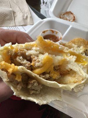 Delicious breakfast burrito (w/ lots of cheese!) with hash brown! Loved it! The salsa is fresh and excellent!