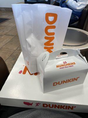 Dozen donuts, munchkins (donut holes), and bonus donut for me