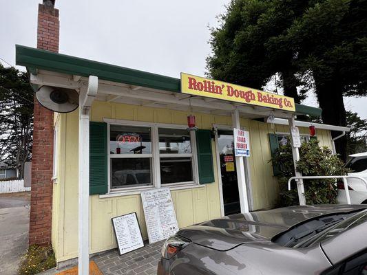 Doorway of Rollin' Dough Bakery, but you have to order and purchase at the side window.