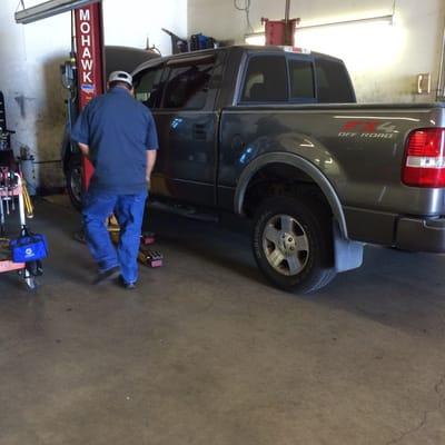 Mechanic - Trini putting my truck on the lift