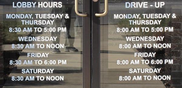 The Farmers State Bank doors list bank hours and window hours.