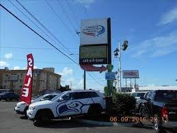 We are directly behind Seattle Chrysler- Dodge- Jeep- Ram dealer.