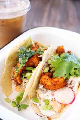 Cajun Shrimp Tacos: Cajun shrimp taco, preserved Meyer lemon, Southern remoulade, cabbage slaw, radish, Overwinter Farm greens ($14).