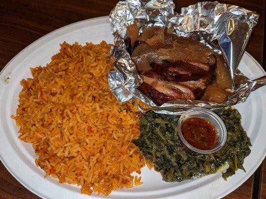 Smoked chicken served with Jollof rice and greens