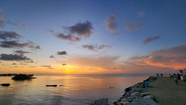 Waterfront with some tables - amazing sunset views