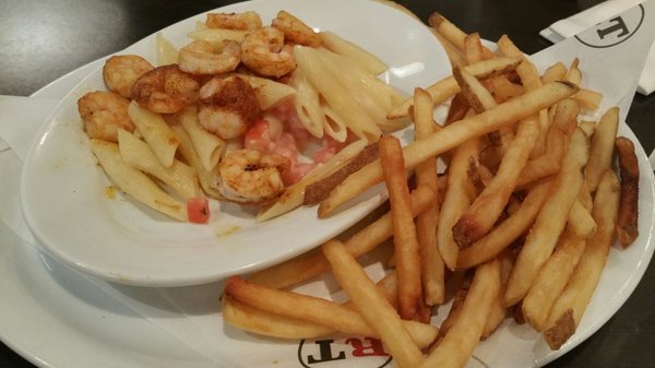 Shrimp scampi with a side of fries