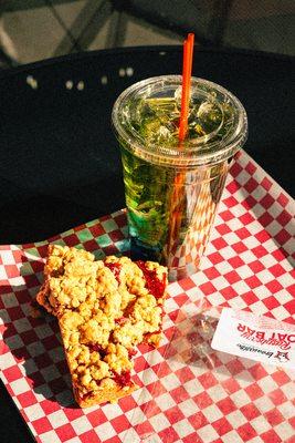 One of our specialty Redbull Italian soda's combo'd with our Raspberry Oat Bar.