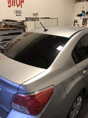 Rear windshield with brake light cutout