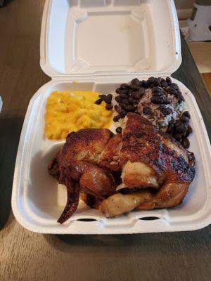 1/2 Chicken with 2 sides (mac n cheese and beans and rice) $11.99 + $.50 upcharge for rice and beans.