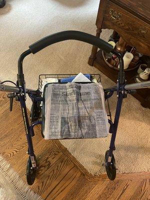 Tried to open up and lay flat on mothers walker to see if possible she can enjoy reading the daily news.