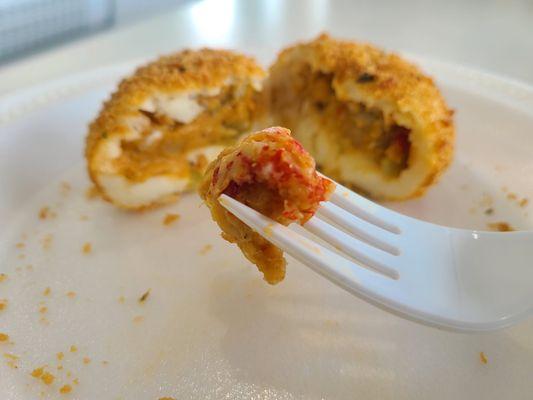 Mashed Potato Ball Filled with Spicy Crawfish Etoufee, Coated in Crispy Panko and Deep Fried   A Bella Flan Original!