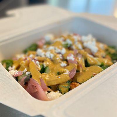 Mediterranean Rice Bowl --falafel, tofu, chicken, or pork w/ rice, stewed chickpeas, kale, onions, cucumbers, feta, spicy lemon dill tahini