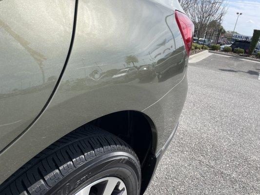 Dent and scrape on rear driver side.