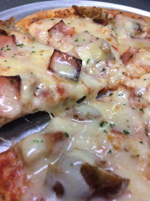 Cordon Blue Pizza smothered with Swiss Cheese