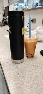 Tiny thai tea that costed $5.70. 20 oz container for comparison