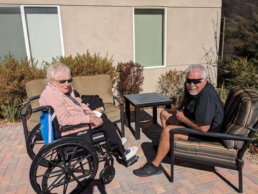 In the courtyard enjoying some  sun.