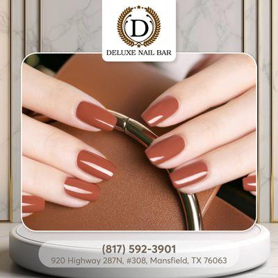 Elevate your spring look with the warmth of brown nail polish, adding a touch of sophistication to your seasonal style palette.