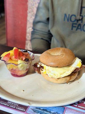 Bacon, egg & cheese on bagel with fruit cup