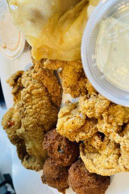 Fish and Shrimp platter with Cajun Cabbage and hush puppies