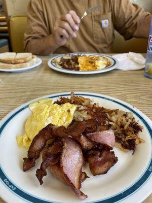 Two eggs scrambled, amazing bacon, crispy hash browns