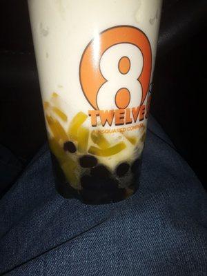 Peach smoothie with mango strips and boba