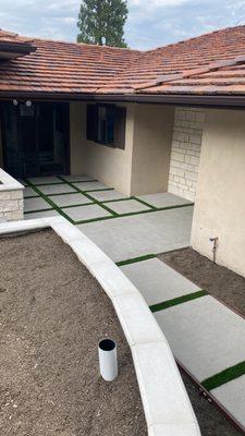 Concrete with turf strips