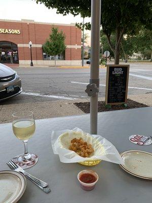 Sitting outside enjoying appetizers and wine