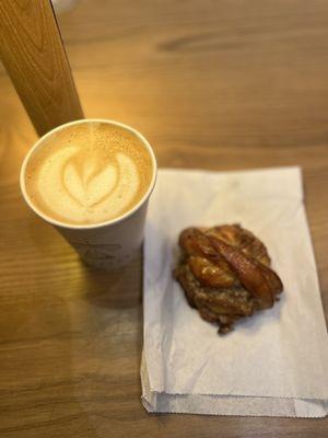 Vanilla latte ($5.60 for 12 oz) and a cinnamon pastry ($6)  IG: @ohmyono