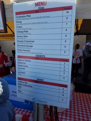 The menu to all the delicious goodies the serve every year. They take cash and cards to buy the food tickets. $1 = 1 ticket