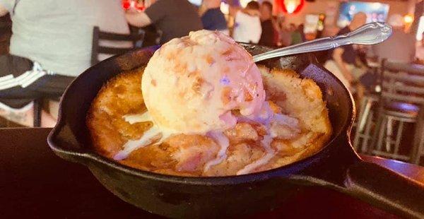 Homemade peach cobbler with homemade peach custard