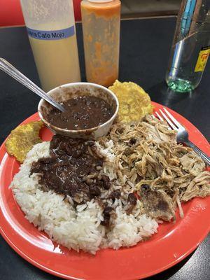 Slow roasted pork with black beans and rice.