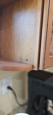 Used drywall screws to attach shelf to cabinet and it shows obviously.