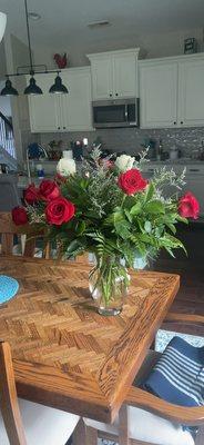 10 red and 2 white roses