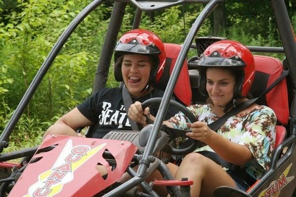 Campers enjoying dune buggies while at Camp Shane.