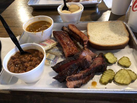 2 Two Meats & Two Sides combo. Brisket and Ribs with Cowboy Baked Beans and Brunswick Stew. The pickles were good too.