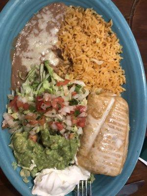 Chimichanga with white meat chicken and rice and beans. Fresh guacamole and homemade salsa!