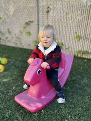 Enjoying some outside play time in our toddler yard.