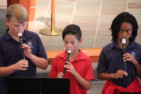 5th graders play their recorders