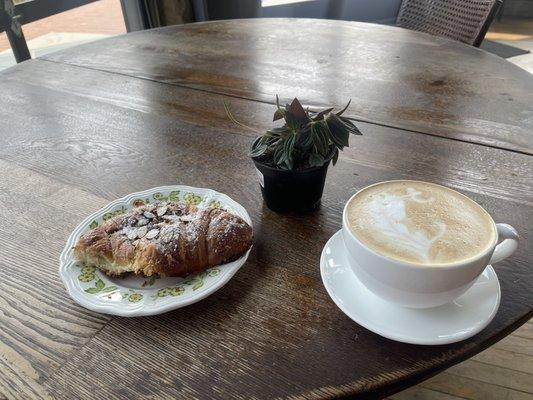 Almond croissant, caramel latte, and a little plant I picked up next door.