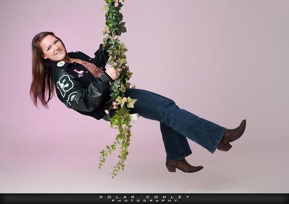 We have a very cool swing in our studio!  See our website http://www.nolanconley.com/seniors