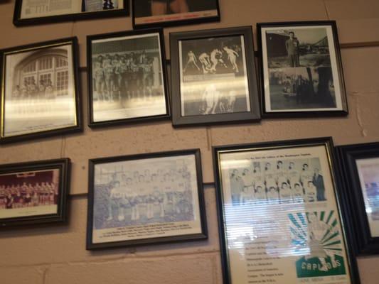 Inside the diner is covered with sports pictures