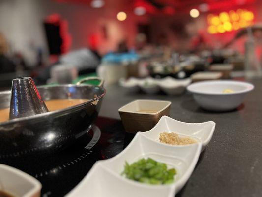 Spicy Miso broth and condiments