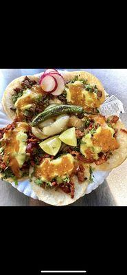 Tacos de adobada with fresh radishes lime. With a side of grilled onion and chile.