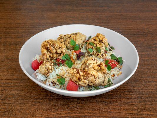 Popcorn Fried Chicken Bowl - Battered and fried chicken in sweet potato flour served over sesame garlic fried rice, with yuzu shoyu sauce