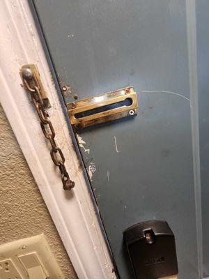 Filthy walls and  door. That chain lock isn't going to prevent someone from kicking in the door..