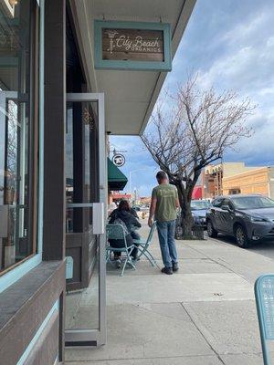 Nice tables outside on the sidewalk